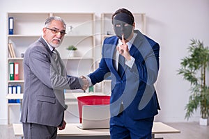 Two businessmen wearing masks during negotiations