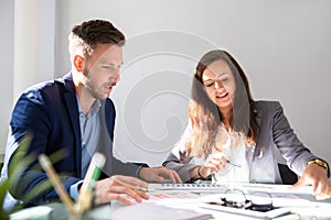 Two Businesspeople Analyzing Graph