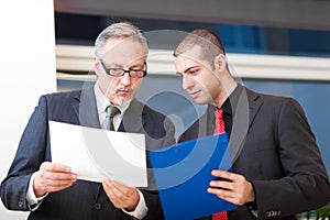 Two businesspeople discussing in the office