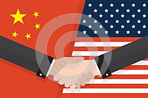 Two businesspeople handshake after good deal in front of an American and Chinese flag. two flags face to face, symbol