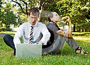 Two businesspeople have a break