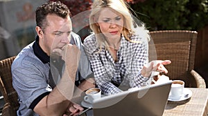 Two Businesspeople Having Informal Meeting In Coffee Shop