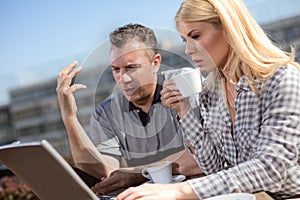 Two Businesspeople Having Informal Meeting In Coffee Shop