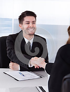 Two businesspeople shaking hand