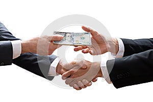 Two Businesspeople Shaking Hands And Receiving Banknote