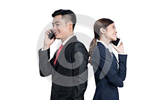 Two businesspeople standing using smart mobile phone