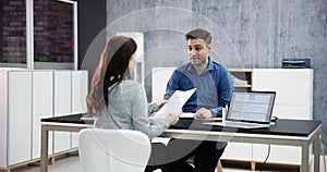 Two Businesspeople Talking With Each Other