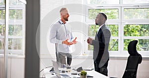 Two Businesspeople Talking With Each Other