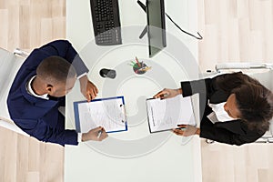 Two Businesspeople Working In Office