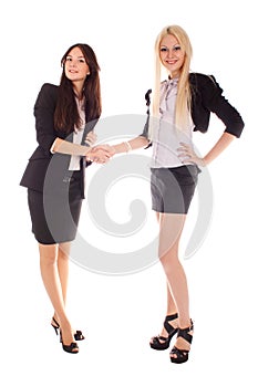 Two businesswoman shake hands
