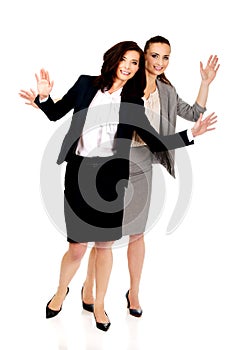 Two businesswoman showing her palms.