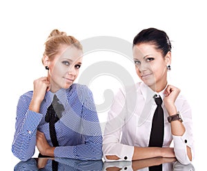 Two businesswoman siting on reflection table photo