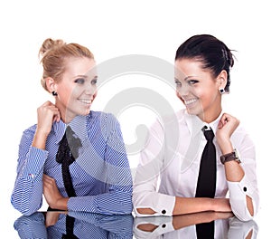 Two businesswoman siting on reflection table photo