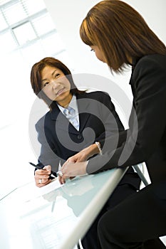 Two businesswomen at desk