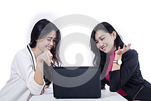 Two businesswomen discussing job