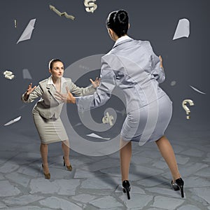 Two businesswomen fighting as sumoist