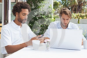 Two busy friends having coffee together