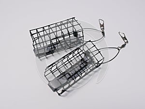 Two cage feeders for feeder fishing on white background