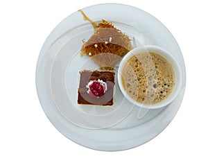 Two cake and coffee cup on dish isolated over white