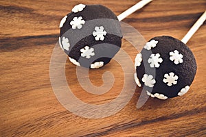 Two cakepops with snowflakes decoration