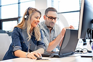 Two call center agents working together