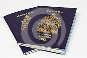 Two Canadian passports on white background