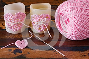 Two candle with pink crochet handmade heart for Saint Valentine