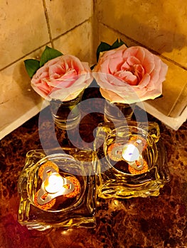 Two Candlelights And Two Pink Roses??