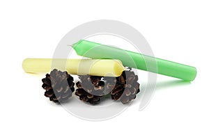 Two Candles and cones isolated on a white background. Green candle