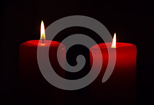 Two candles, dark background, christmas time