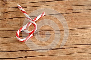 Two candy canes that is entwined together