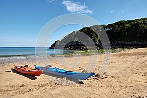 Two canoes, Barafundle Beach,Bay near Stackpole,Pembrokeshire,Wales,U.K