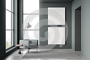 Two canvases in dark green and grey living room with single armchair