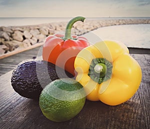 Two capsicums with lemon and avocado