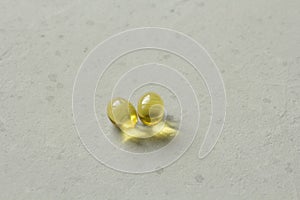 Two capsules food supplement oil filled capsules suitable vitamin A, vitamin D3, fish oil, omega 3, 6, 9, evening primrose, borage