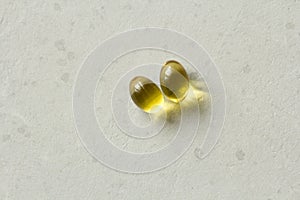 Two capsules food supplement oil filled capsules suitable vitamin A, vitamin D3, fish oil, omega 3, 6, 9, evening primrose, borage