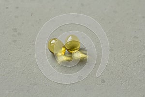 Two capsules food supplement oil filled capsules suitable vitamin A, vitamin D3, fish oil, omega 3, 6, 9, evening primrose, borage
