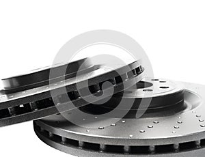 Two car brake disc isolated on white background. Auto spare parts. Perforated brake disc rotor isolated on white. Braking