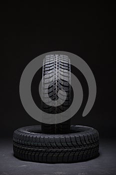 Two car tires with winter print