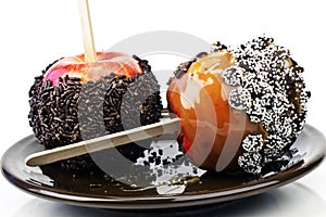 Two caramel candy apples with chocolate