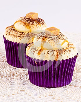 Two Caramel Cupcakes in Purple Papers