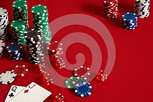 Two cards and chips on a red background. Big bet of game money. Cards - the lady and the jack. Your distribution at the