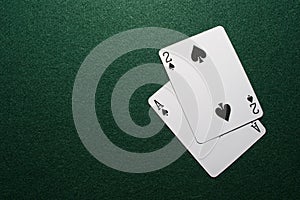 Two cards on green felt