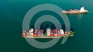 two cargo container ship sailing in sea to import export goods and distributing products to dealer and consumers across worldwide