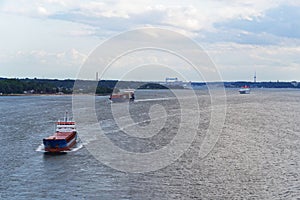 Two Cargo ships leaving harbor of Kiel, Germany