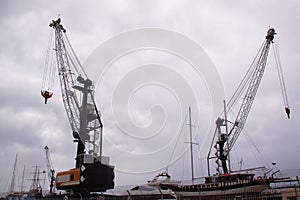 Two cargo ships and other boats in port