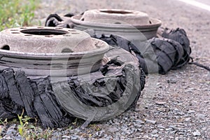 Destroyed blown tire with crushed and damaged rubber on a truck.