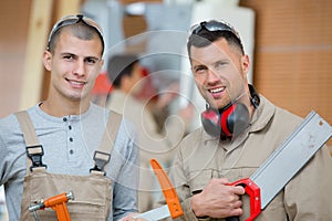 Two carpenters posing to camera photo