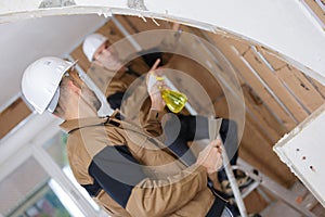 two carpenters talking at construction site