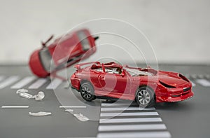 Two cars accident crash on road  insurance case, broken toys car